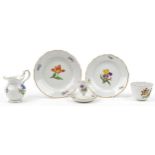 Meissen, German porcelain hand painted with flowers comprising cup, two plates, milk jug and eggcup,
