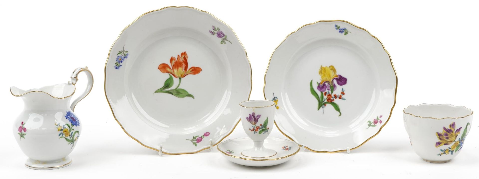 Meissen, German porcelain hand painted with flowers comprising cup, two plates, milk jug and eggcup,