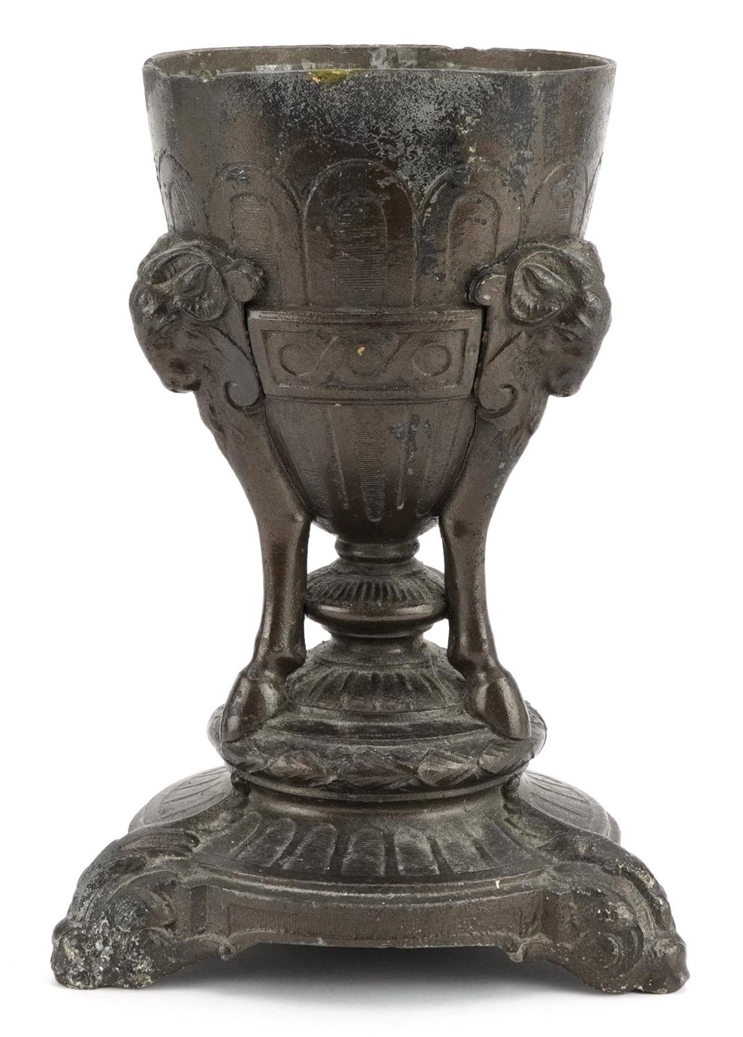 Classical patinated metal centrepiece with rams heads, 23.5cm high : For further information on this