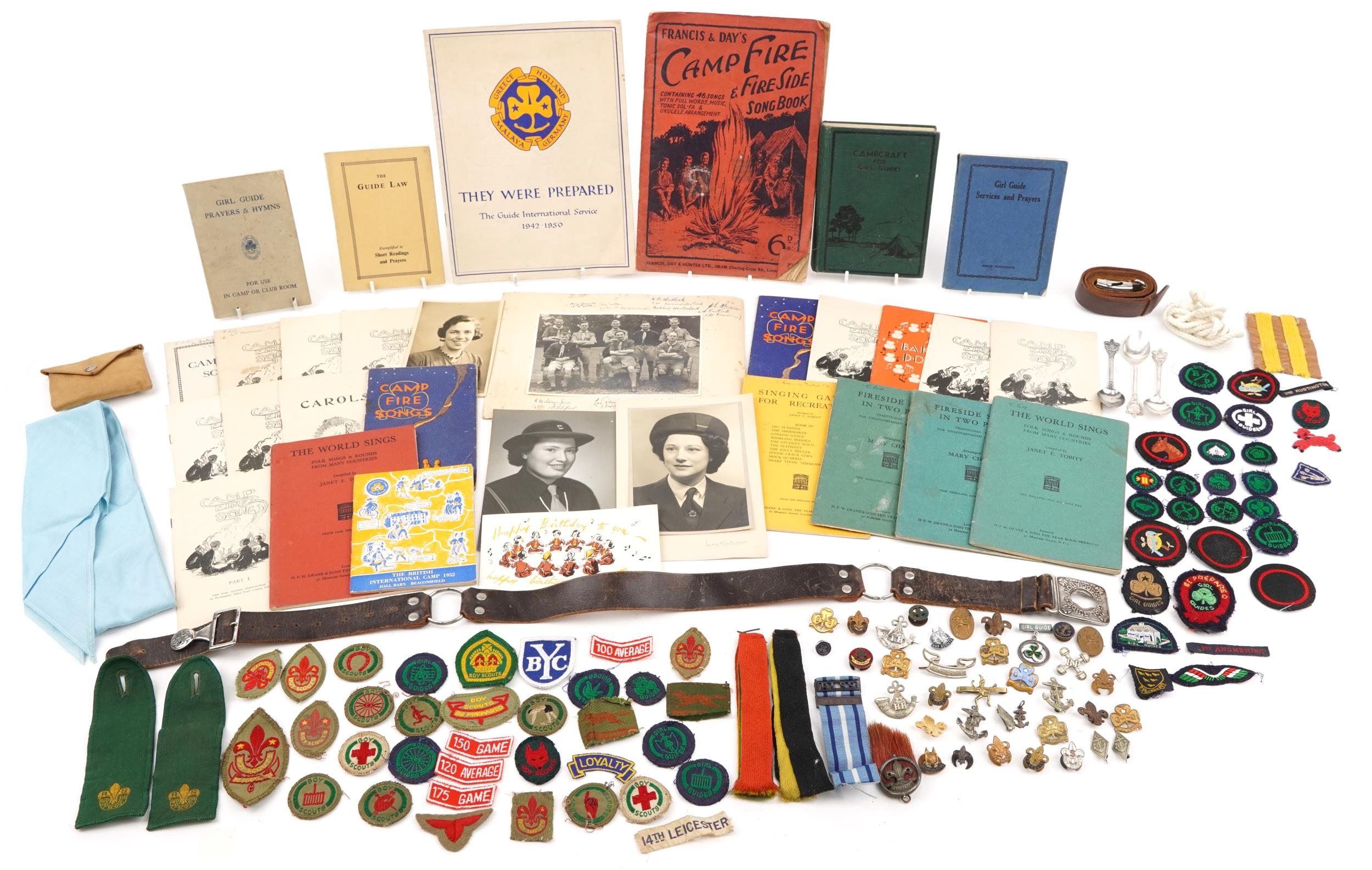 Collection of Scouts and Girl Guides memorabilia including various books, cloth patches, two