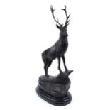 Large patinated bronze stag raised on a black marble base, 73cm high : For further information on