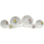 Meissen, German porcelain hand painted with flowers including daffodils comprising two cups with