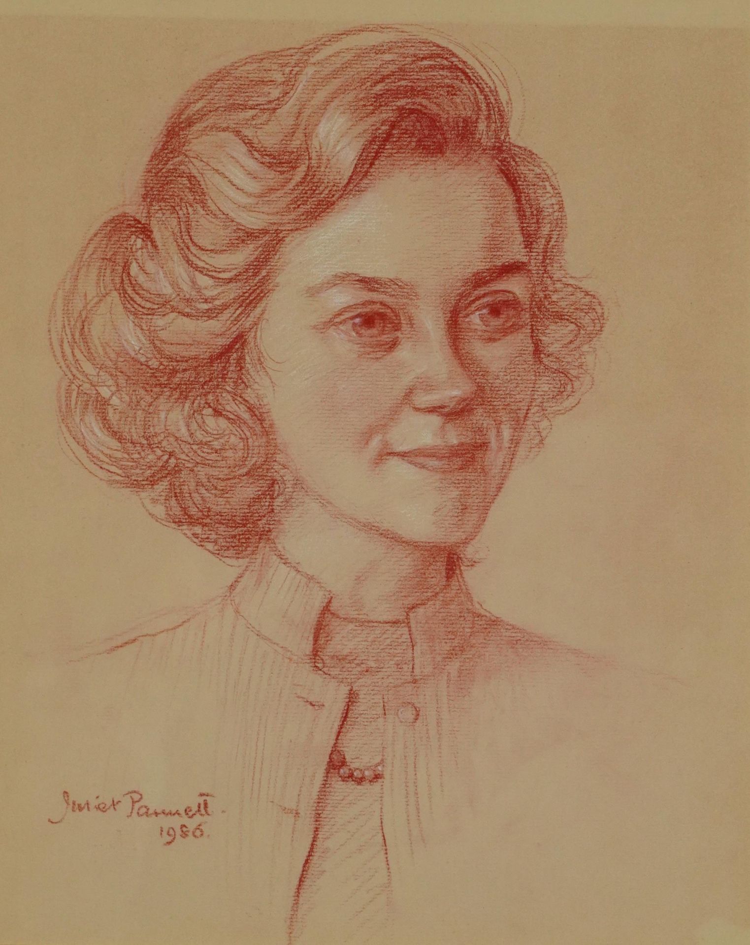 Juliet Pannett 1986 - Head and shoulders portrait of a female, heightened sanguine chalk, mounted,