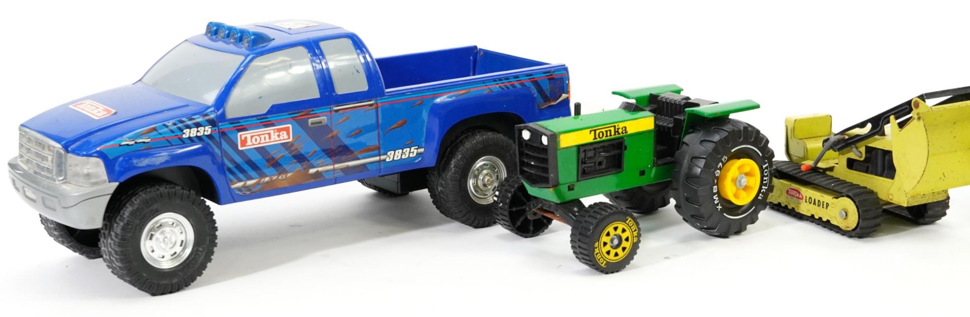 Four vintage Tonka tinplate agricultural vehicles and a large Tonka battery operated 4 X 4, the - Image 2 of 4