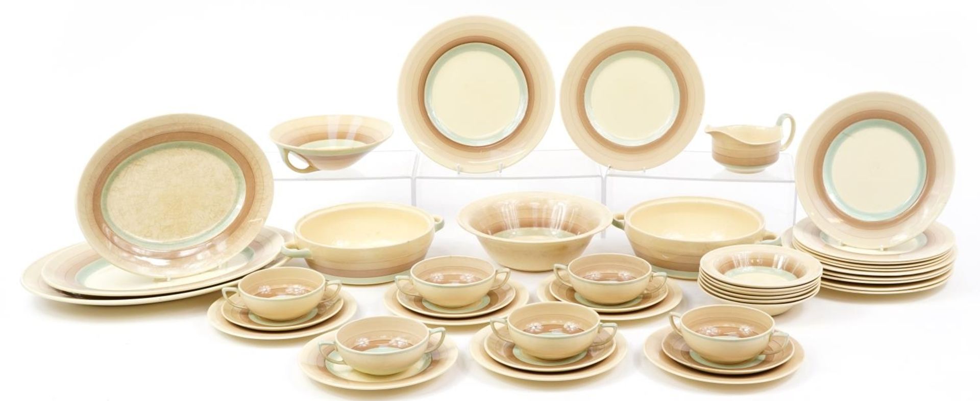 Susie Cooper, Art Deco dinnerware including lidded tureen, plate and graduated meat platters, the