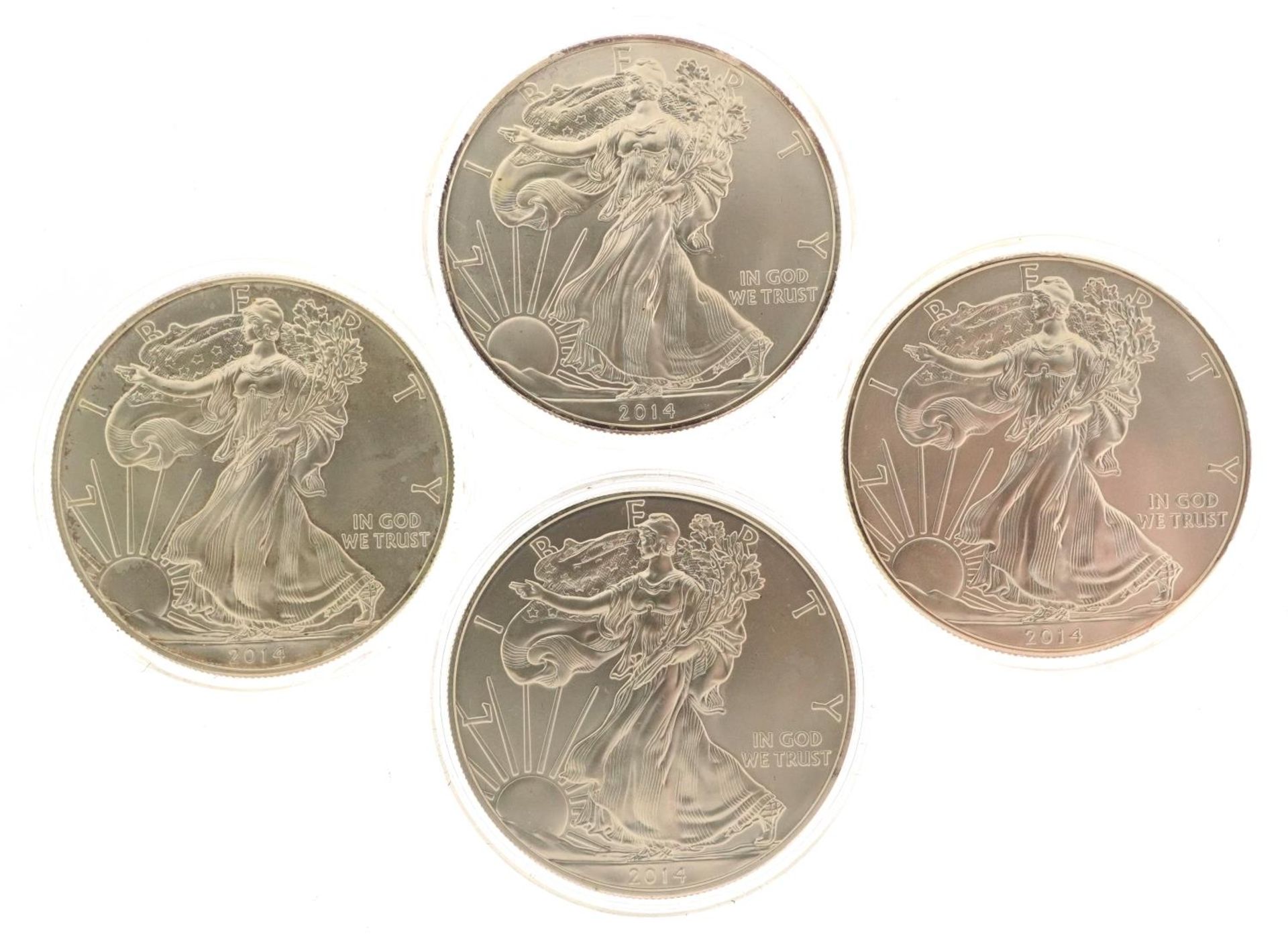 Four 2014 United States of America one ounce fine silver Liberty dollars : For further information