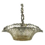 The Metcalfe Company, sterling silver gilt pierced basket with swing handle embossed with flowers