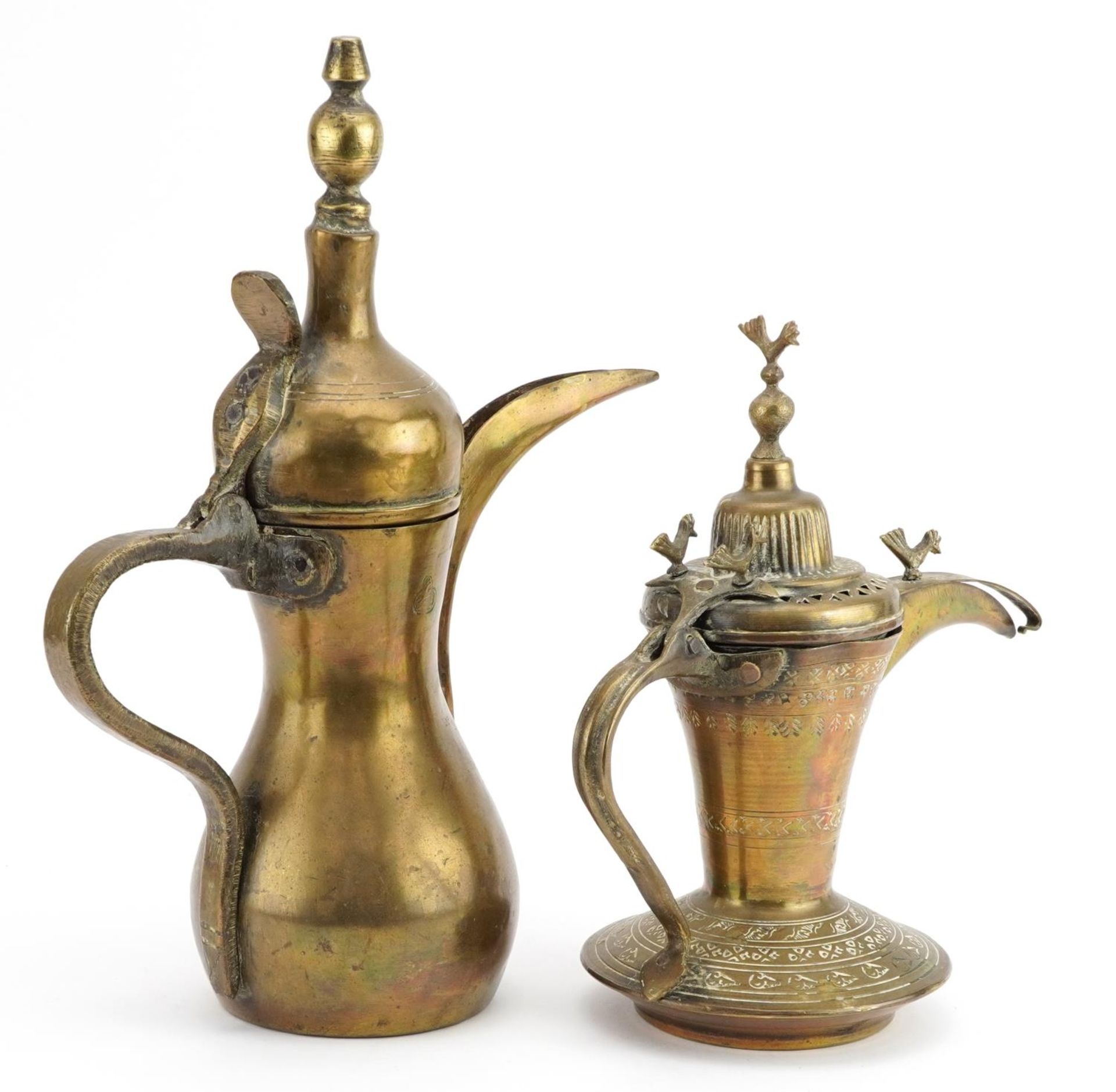 Two Omani brass dallah coffee pots including one with impressed decoration, the largest 31cm - Image 2 of 4