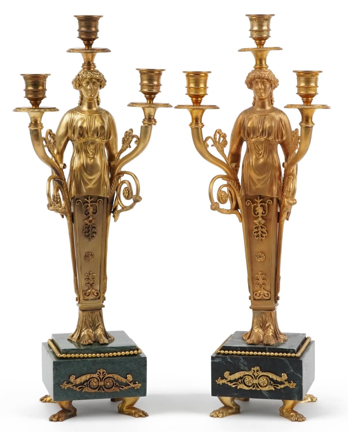 Pair of French Empire style ormolu three branch figural candelabras raised on square marbleised