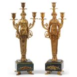 Pair of French Empire style ormolu three branch figural candelabras raised on square marbleised