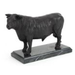 Patinated bronze study of a bull raised on a rectangular marble base, 26cm in length : For further