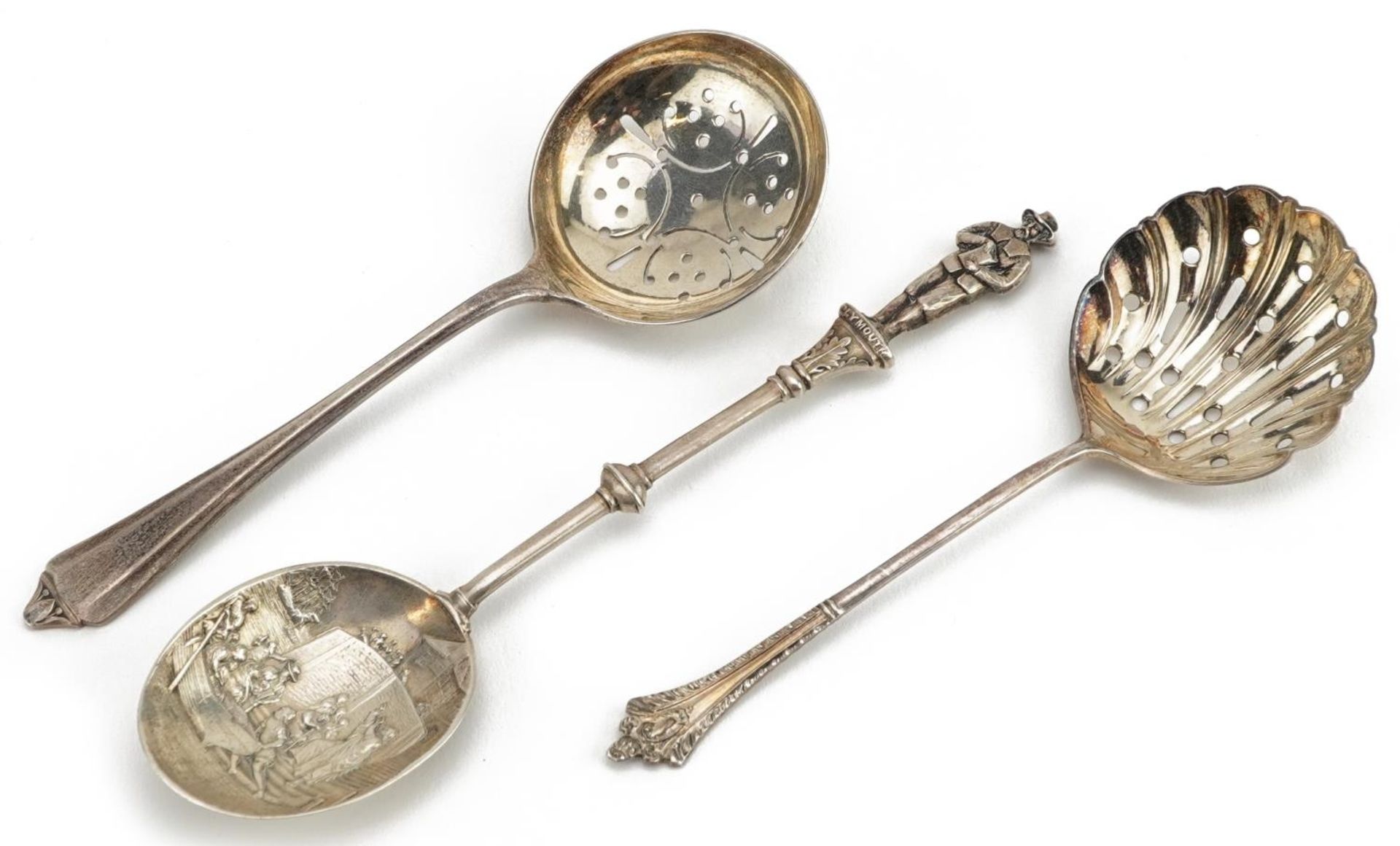 Two Victorian and later silver sifting spoons and a silver Plymouth souvenir teaspoon, the largest