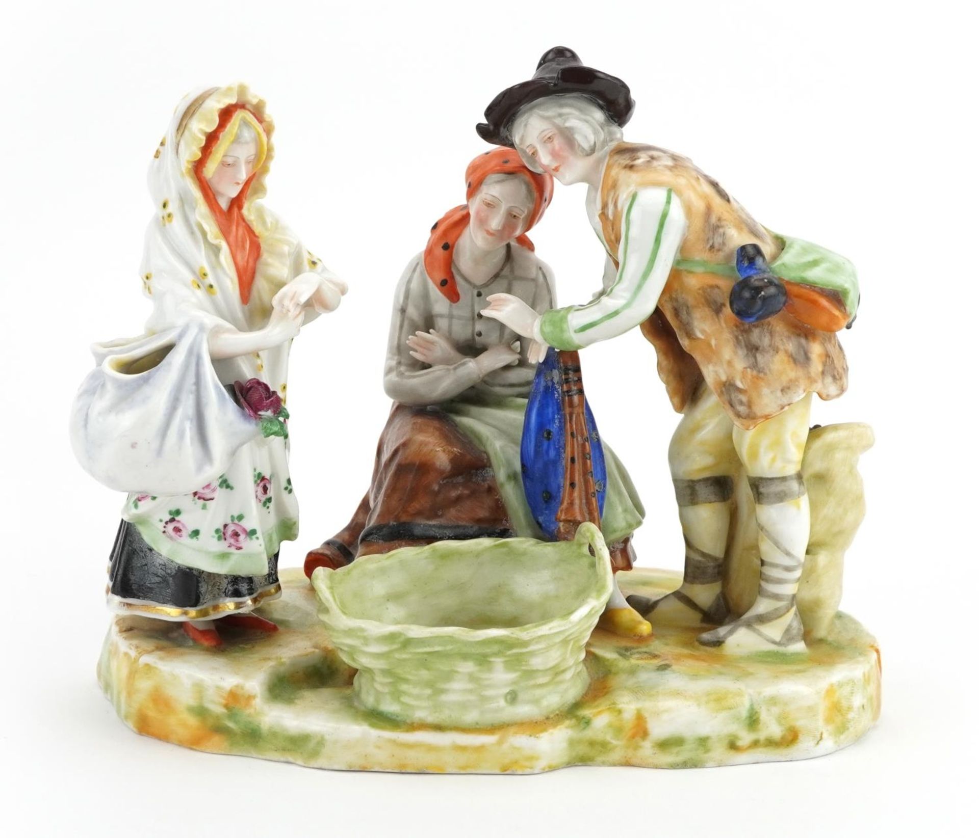 Austrian porcelain figure group of two peasants and a female holding a bag with flowers, 19cm wide :