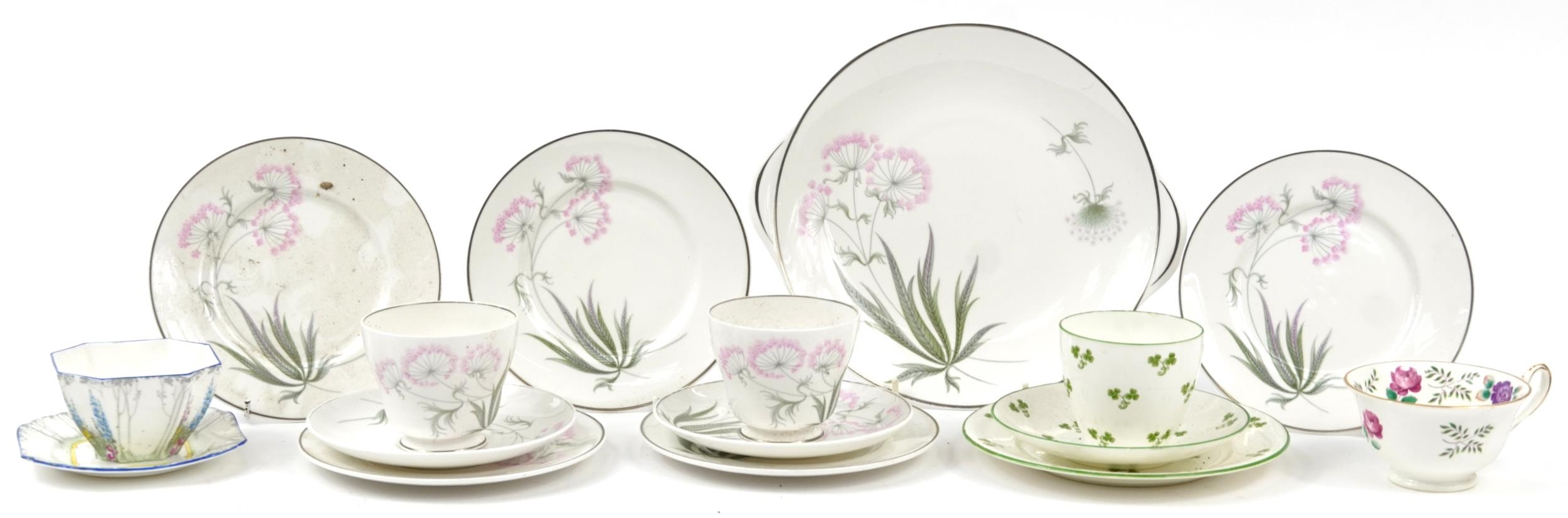 Collection of Shelley Art Deco porcelain teaware including trios, sugar bowl and cake plate, the