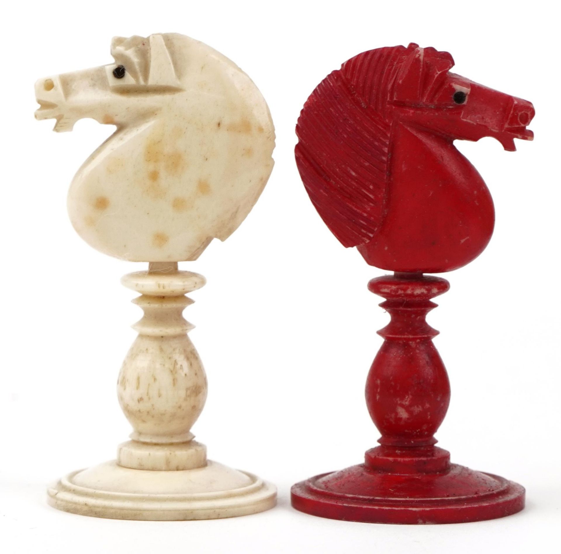 Half stained carved bone chess set with mahogany case having sliding lid, the largest pieces each - Image 5 of 6