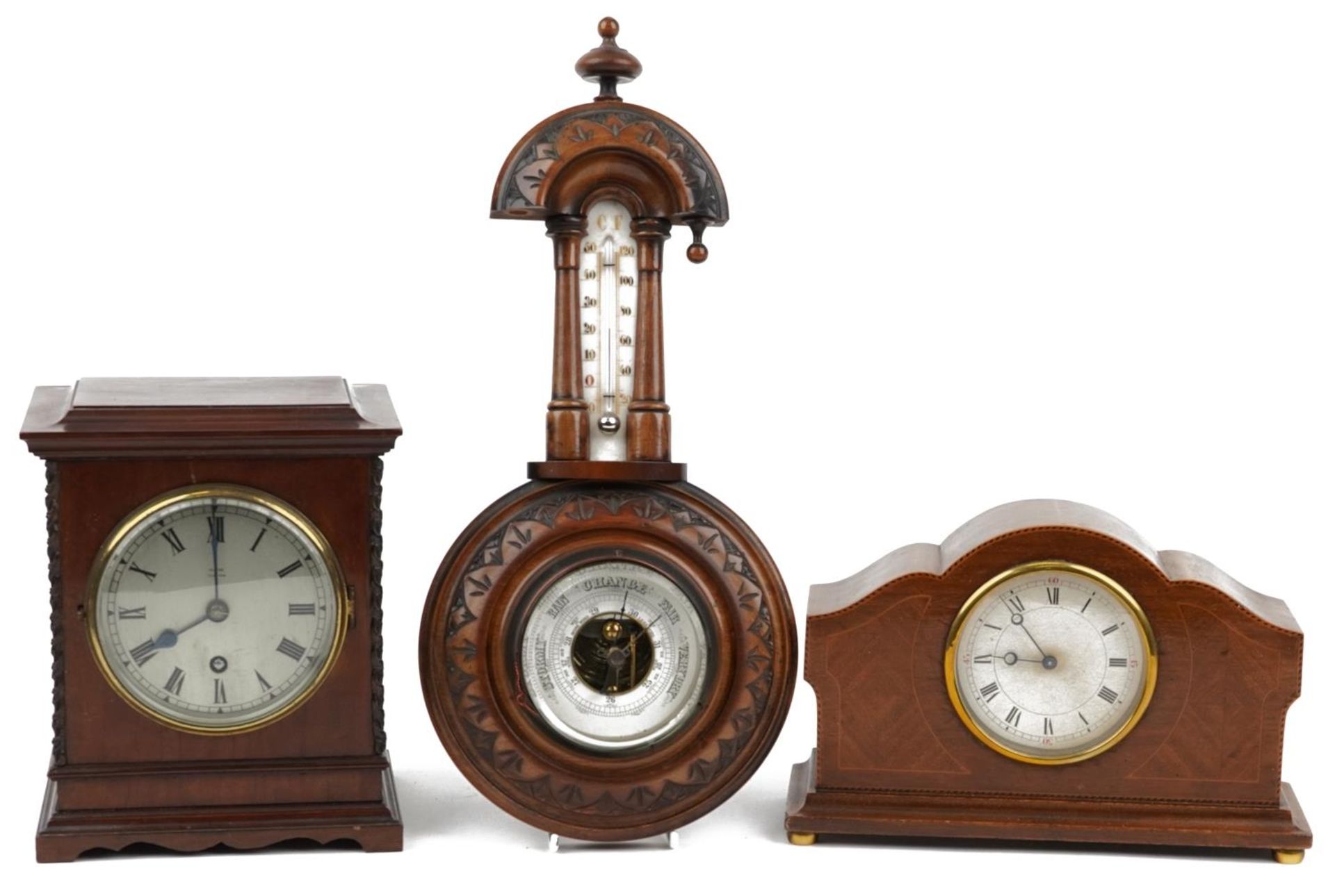 Two mahogany cased mantle clocks and a carved oak wall hanging barometer including Edward of