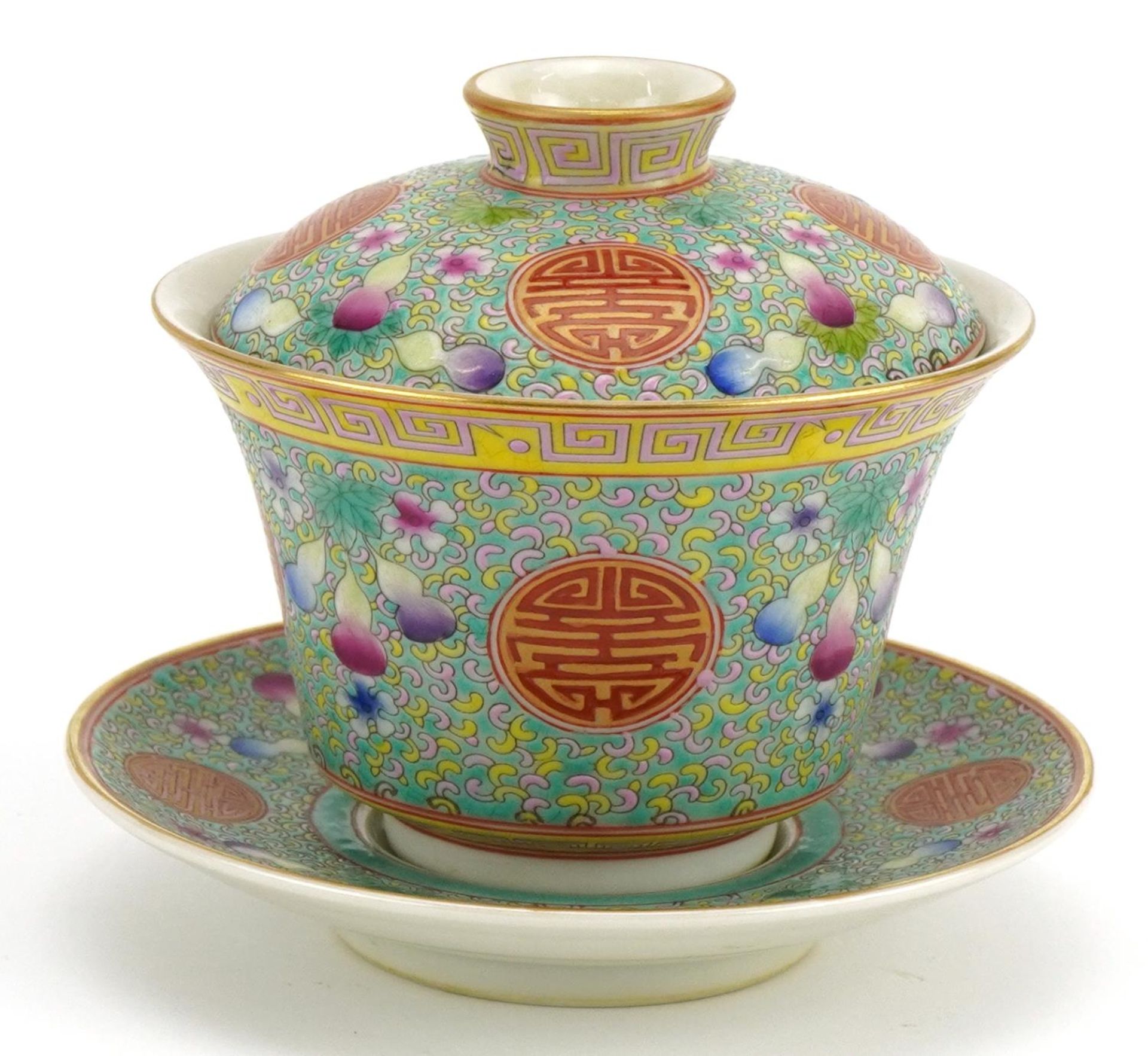 Chinese blue ground porcelain tea bowl and cover on stand hand painted in the famille rose palette