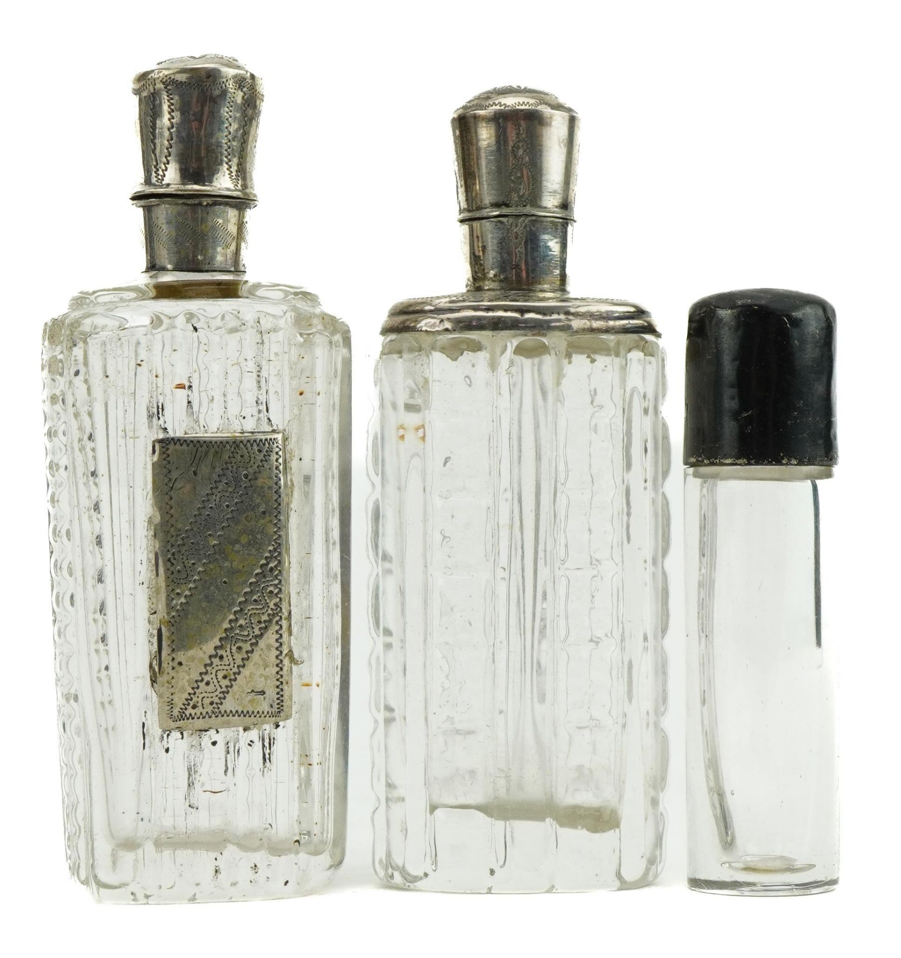 Two antique Dutch silver mounted cut glass scent bottles and a Victorian glass scent bottle with