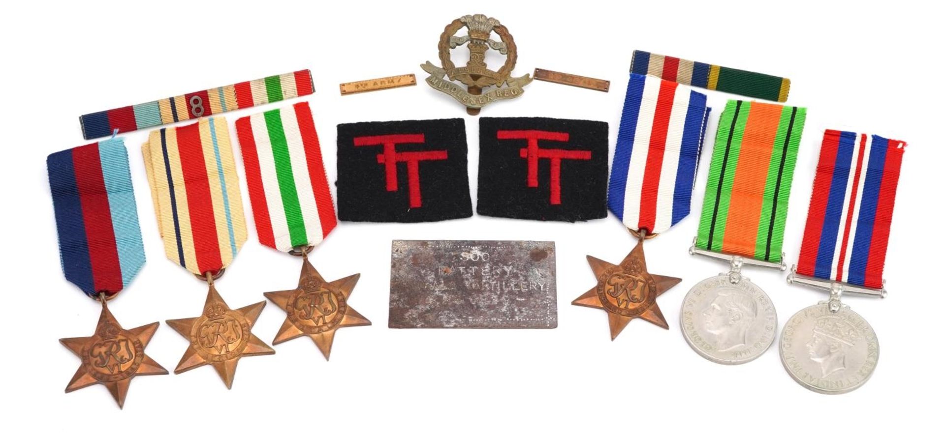 British military World War II six medal group with Middlesex Regiment cap badge and plaque