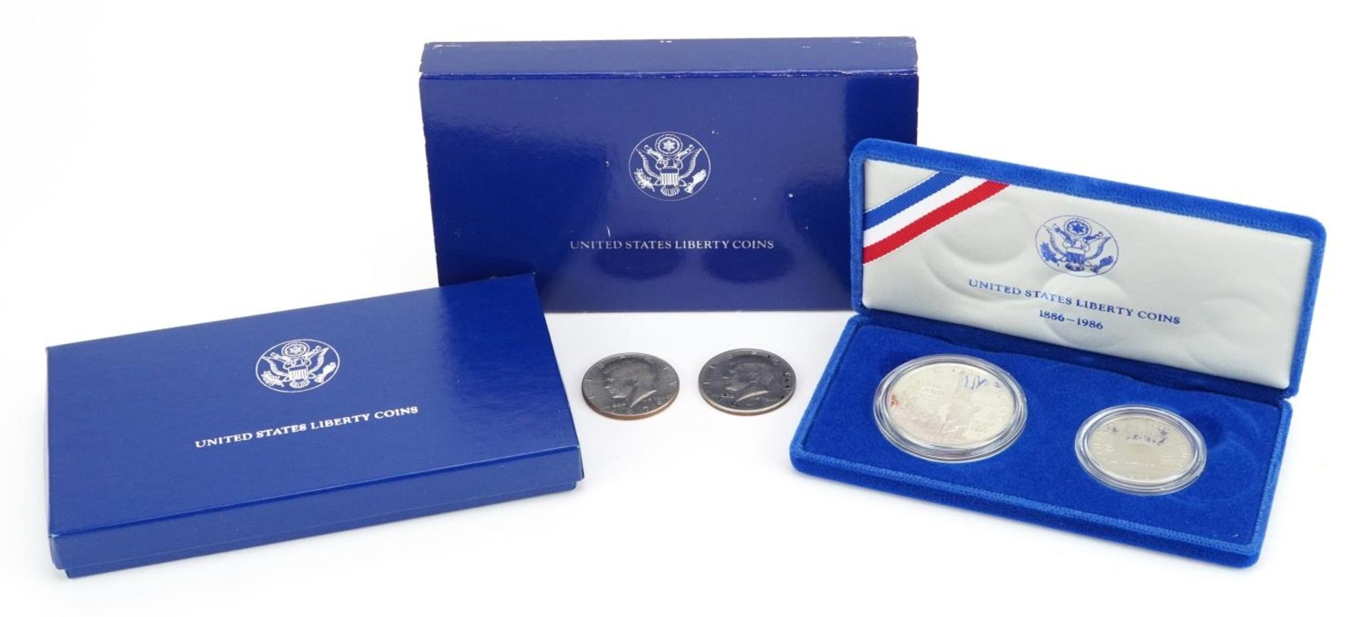 United States of America silver proof 1986 Liberty dollar and half dollar with case and box and