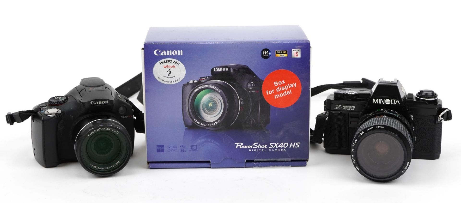 Two cameras comprising Canon Powershot SX40HS with box and Minolta X-300 with 35-70mm lens : For