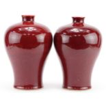 Pair of Chinese porcelain baluster vases having sang de boeuf glazes, each 29cm high : For further