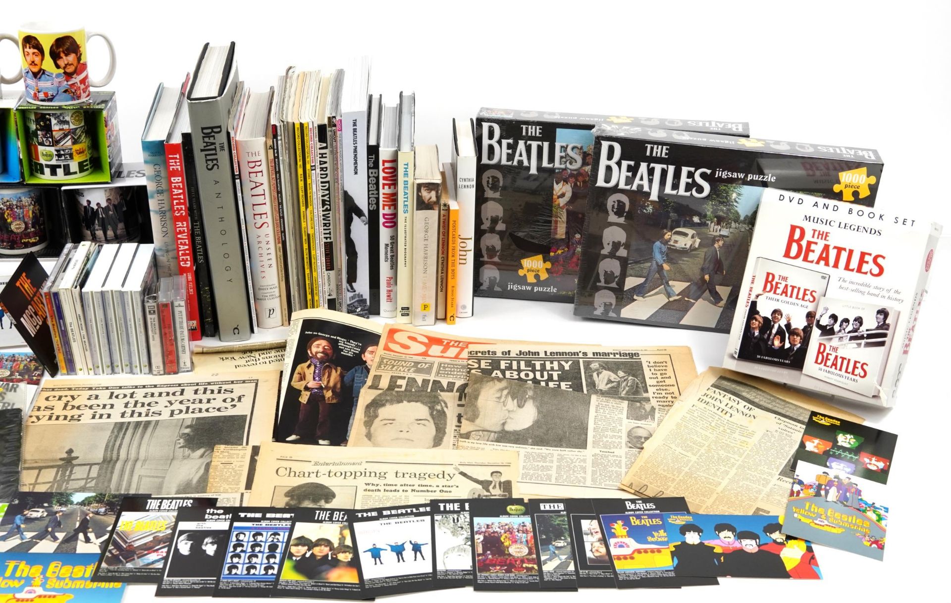 The Beatles ephemera and memorabilia including mugs, jigsaw puzzles, hardback books, CDs and tape - Image 2 of 2