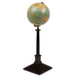 Floor standing Legend twelve inch rotating globe, 94cm high : For further information on this lot