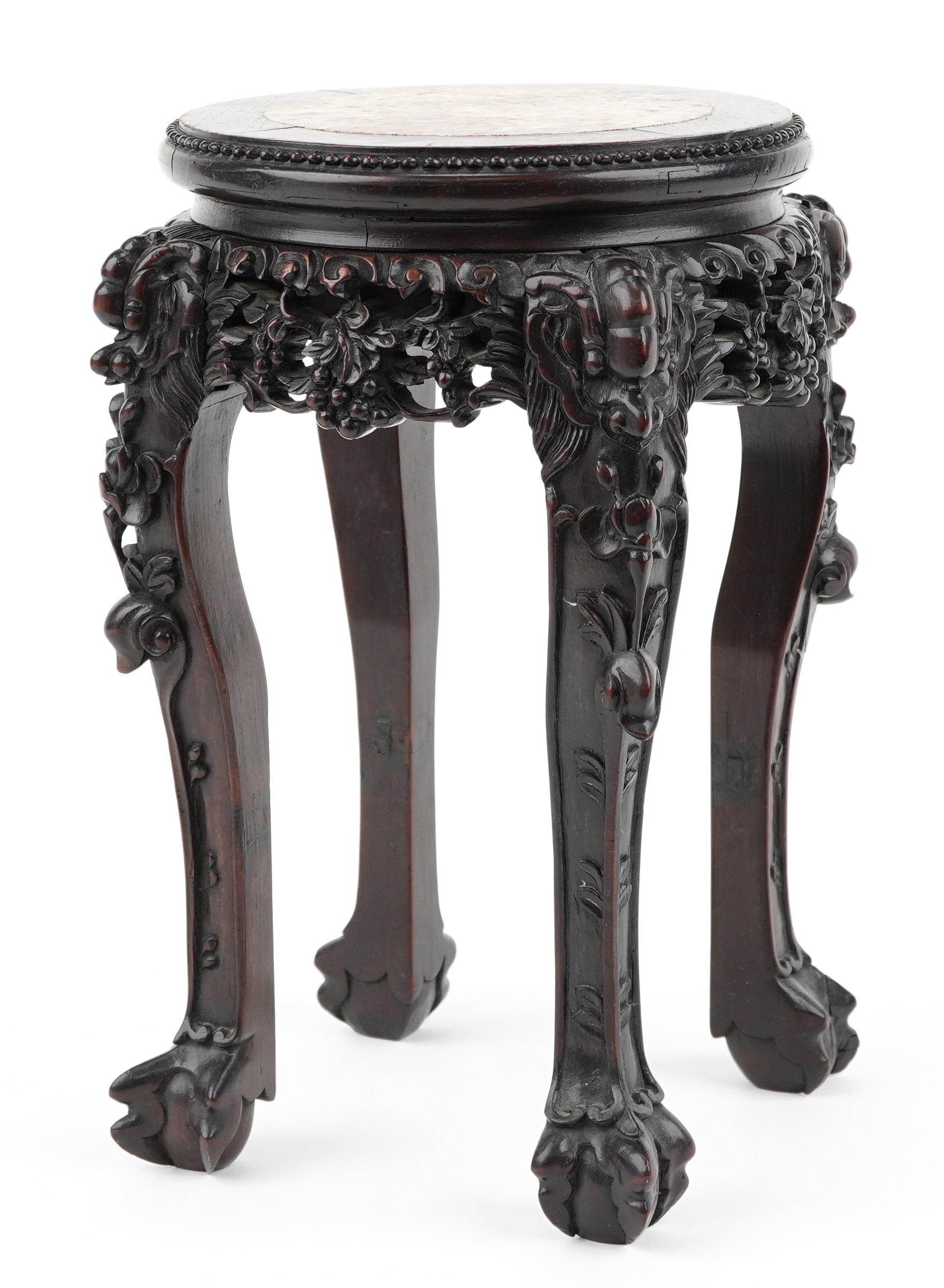 Chinese hardwood vase stand with inset marble top finely carved with mythical faces and foliage,