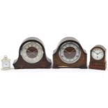 Three oak cased mantle clocks, one with Westminster chime and a Swiza carriage clock, the largest