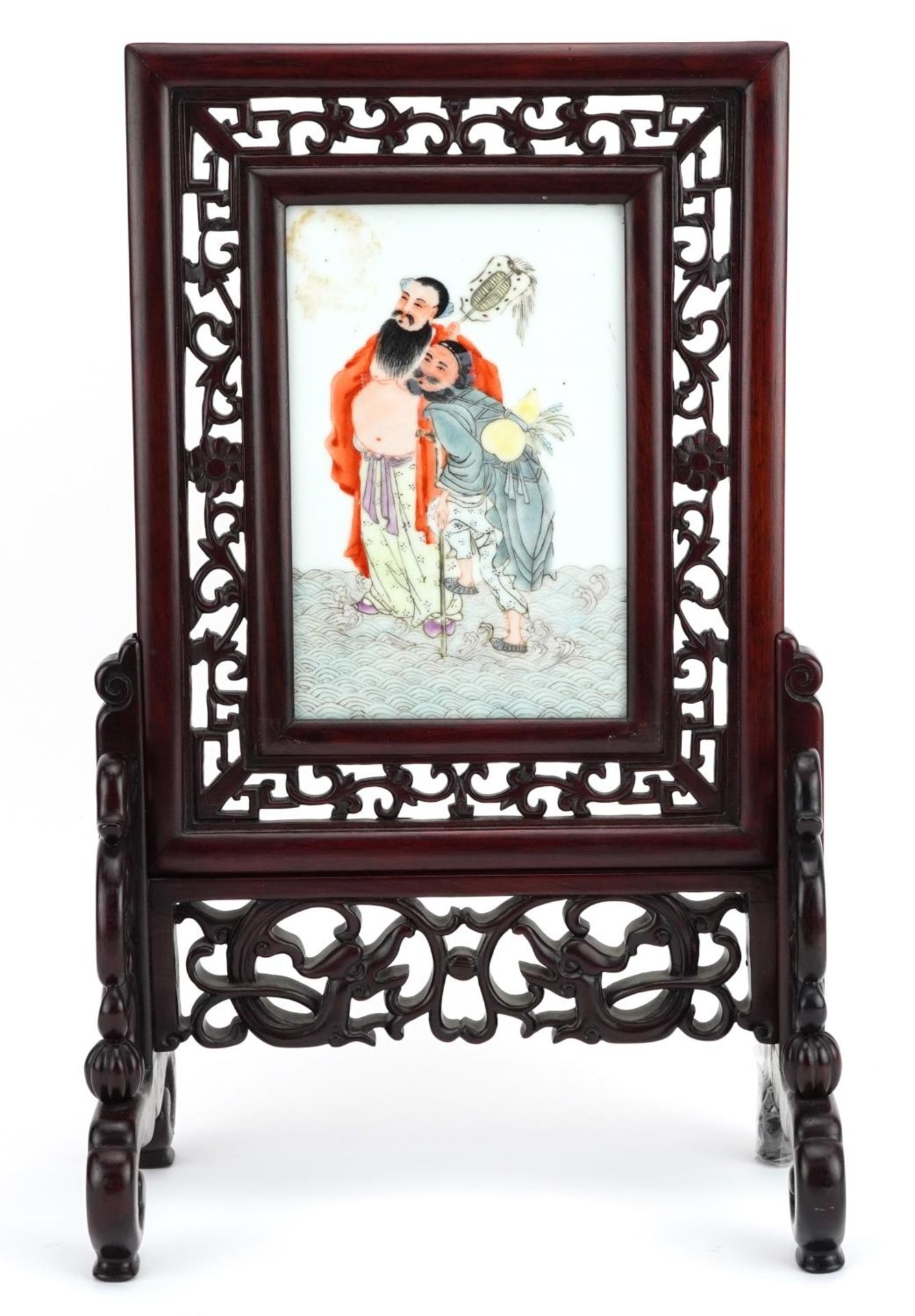 Chinese porcelain and carved hardwood table screen, the panel hand painted with two figures, 40cm