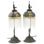 Pair of bronzed Tiffany design table lamps with leaded glass shades and glass drops, 49cm high : For