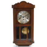 Oak cased Westminster chiming wall clock, the silvered dial with Arabic numerals, 64cm high : For