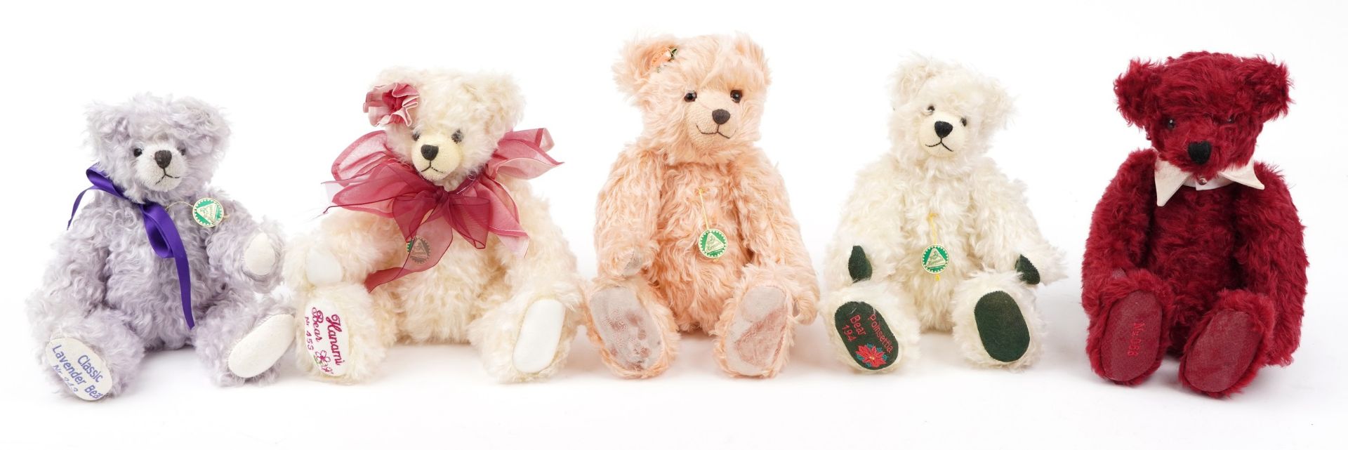 Five Hermann teddy bears, three with growlers, including Classic Lavender bear no 243, Poinsettia