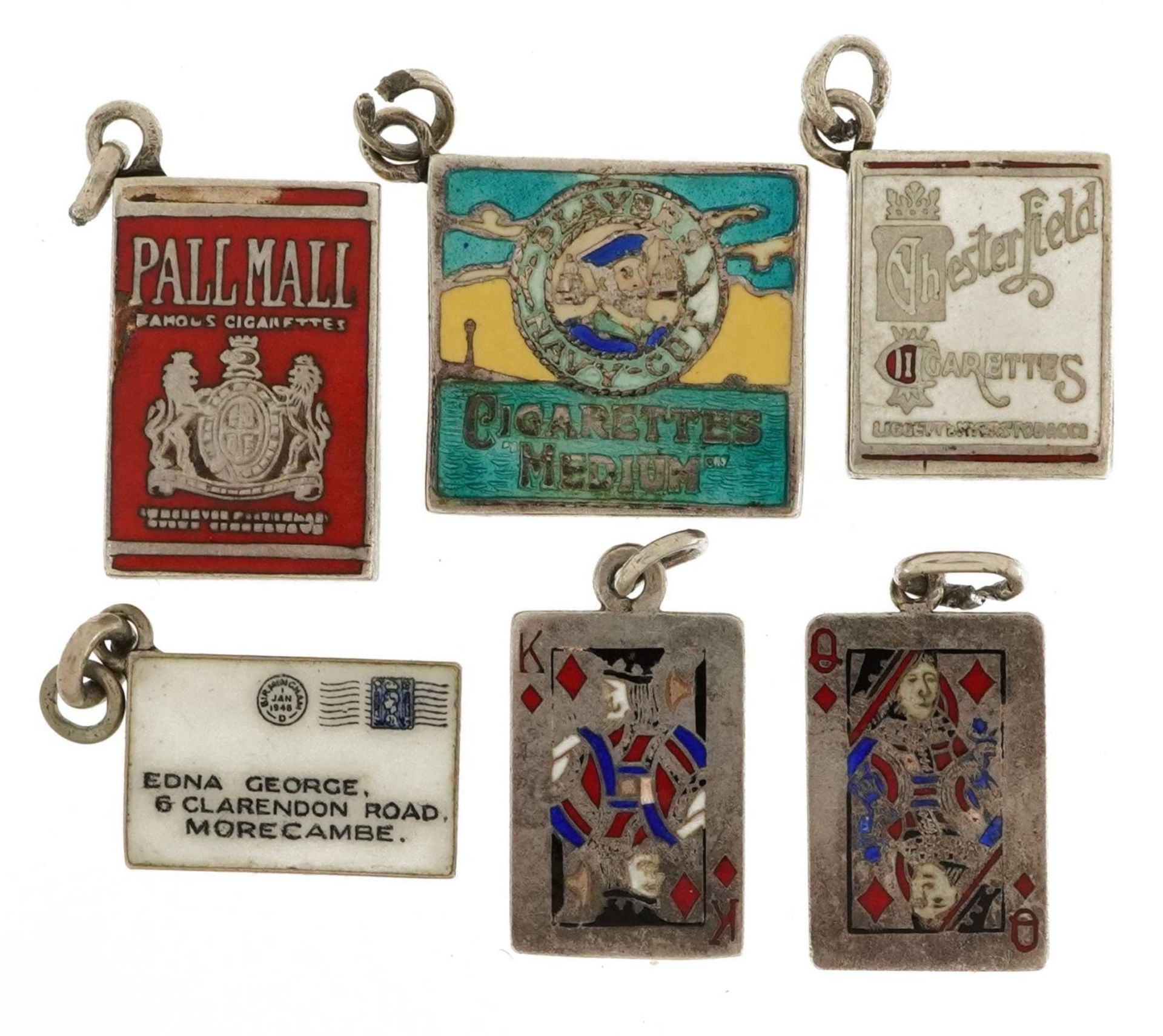 Six silver and white metal enamel charms comprising king and queen playing cards, envelope and