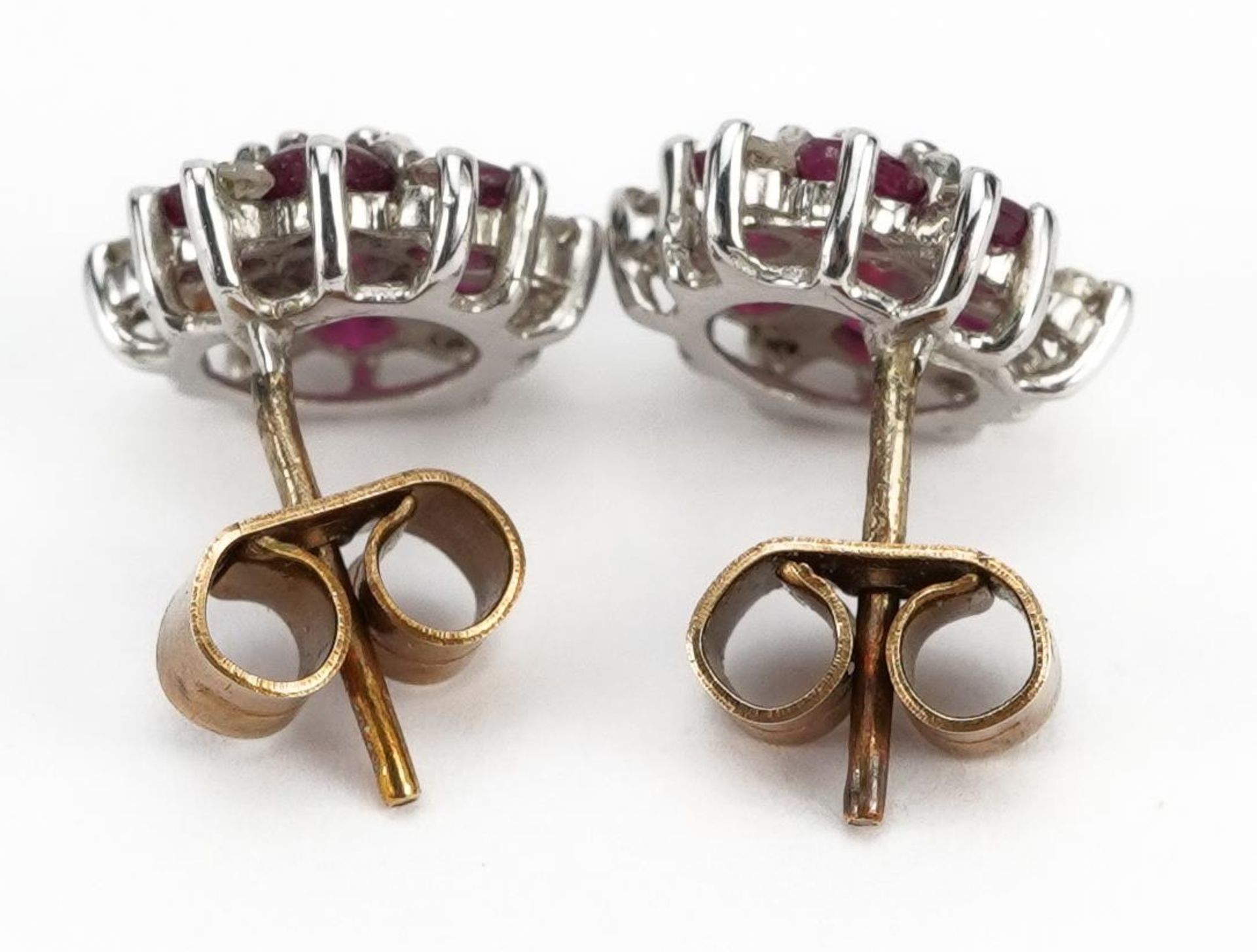 Pair of 9ct gold ruby and diamond cluster stud earrings, 1.0cm in diameter, 1.6g : For further - Image 2 of 2