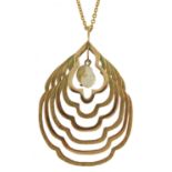 Large unmarked gold graduated pendant set with a freshwater pearl on an 18ct gold Belcher link