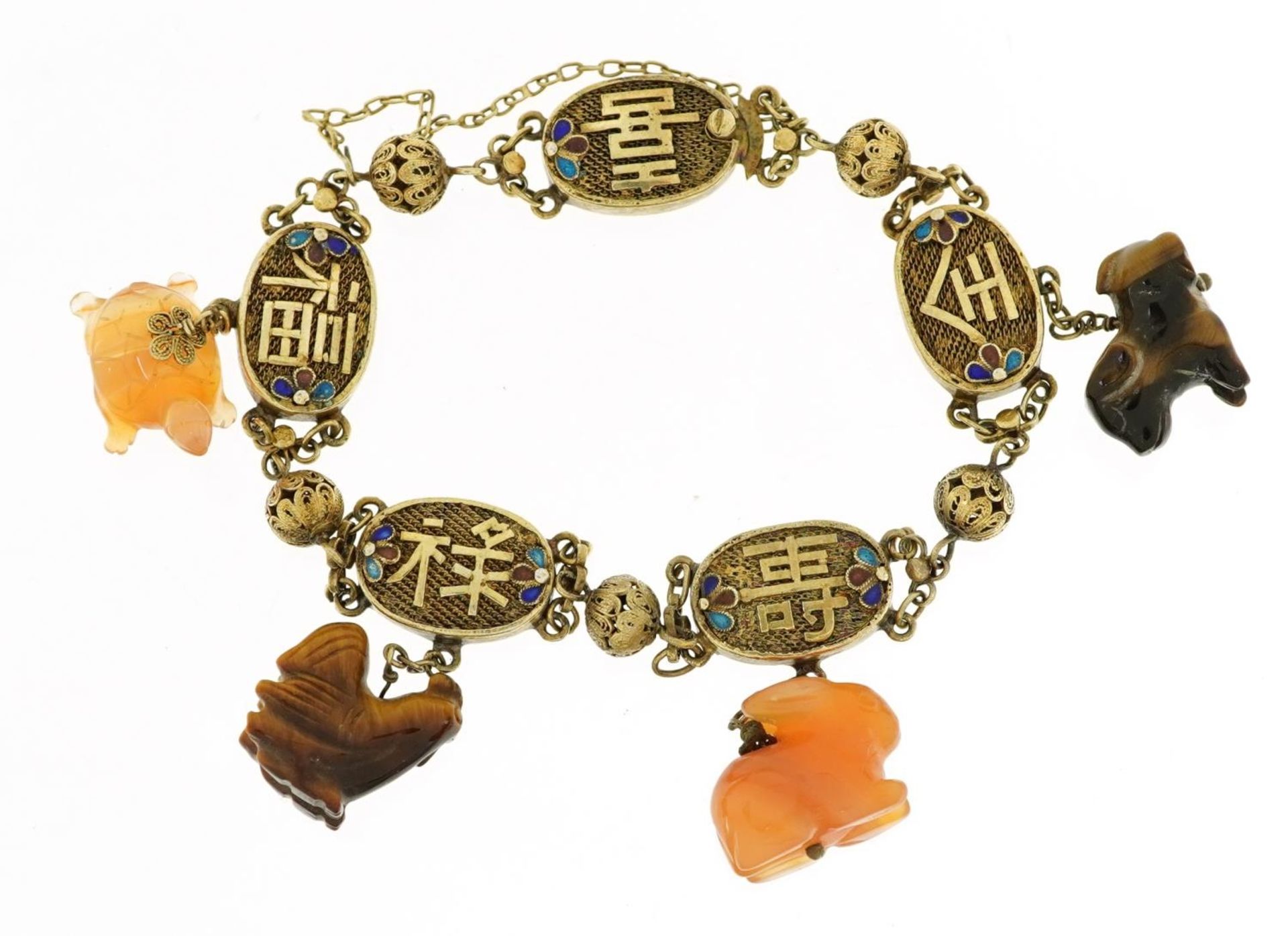 Chinese silver gilt and enamel bracelet with four carved tiger's eye and agate animal charms, 28.