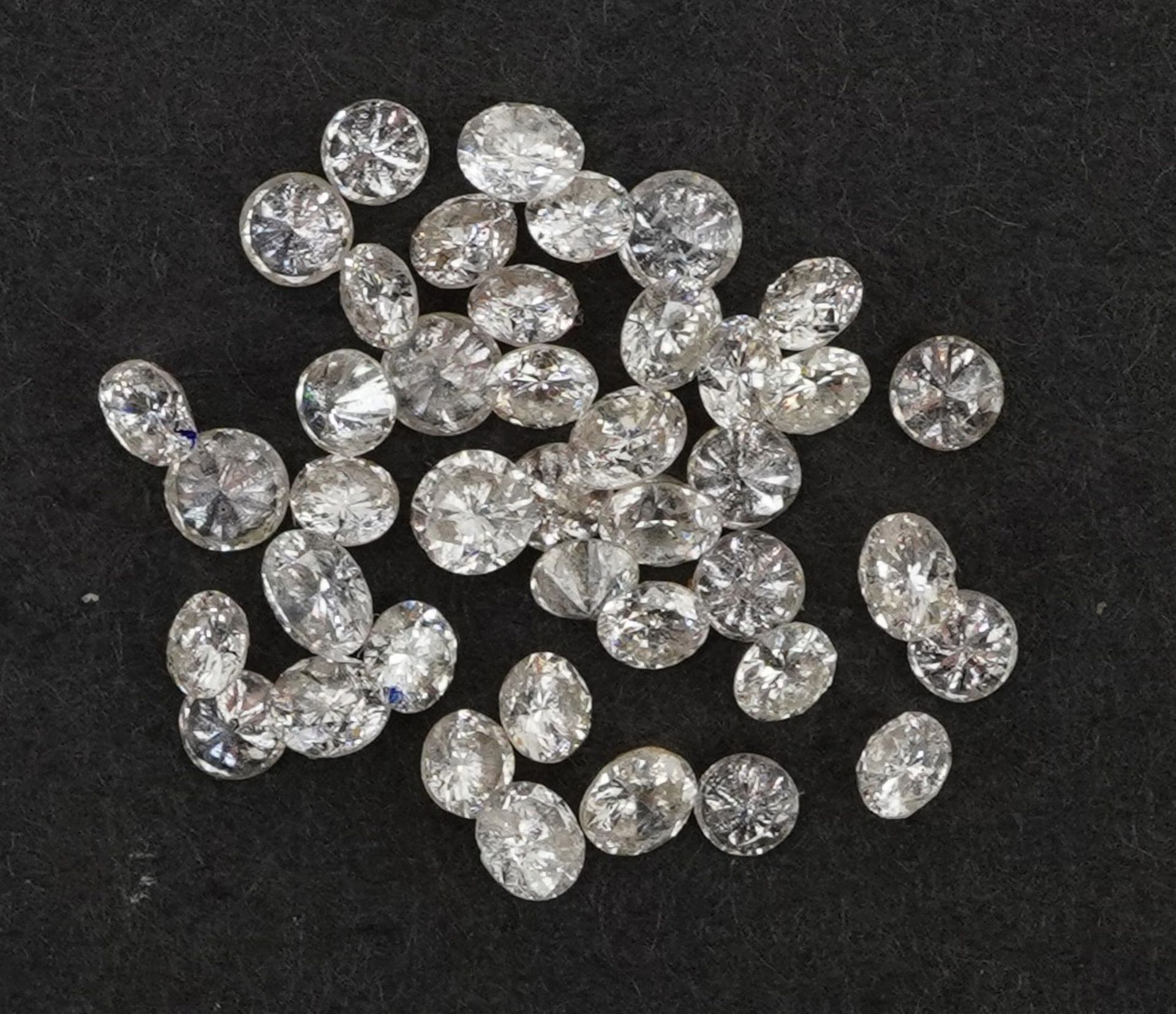 Collection of loose solitaire diamonds, the largest approximately 2.5mm in diameter, total weight