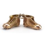 9ct gold football boots charm, 1.7cm wide, 7.2g : For further information on this lot please contact