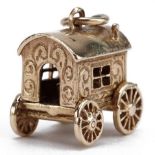 9ct gold Gypsy caravan opening to reveal a figure, 1.5cm wide, 4.2g : For further information on