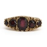 Victorian style 9ct gold garnet five stone ring, the largest garnet approximately 6.6mm x 5.3mm,