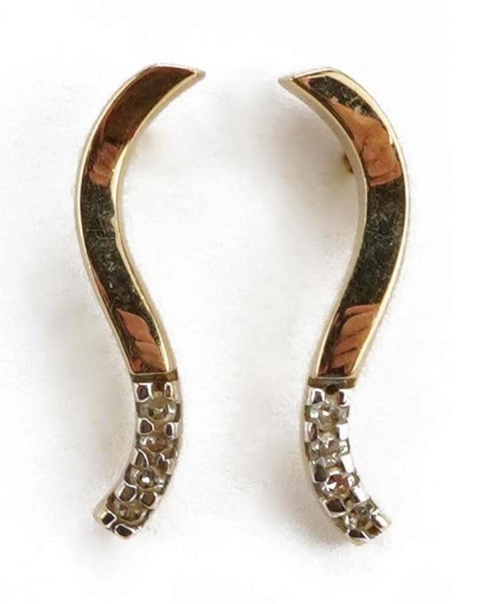 Pair of unmarked gold diamond stud earrings, 1.5cm high, 1.0g : For further information on this