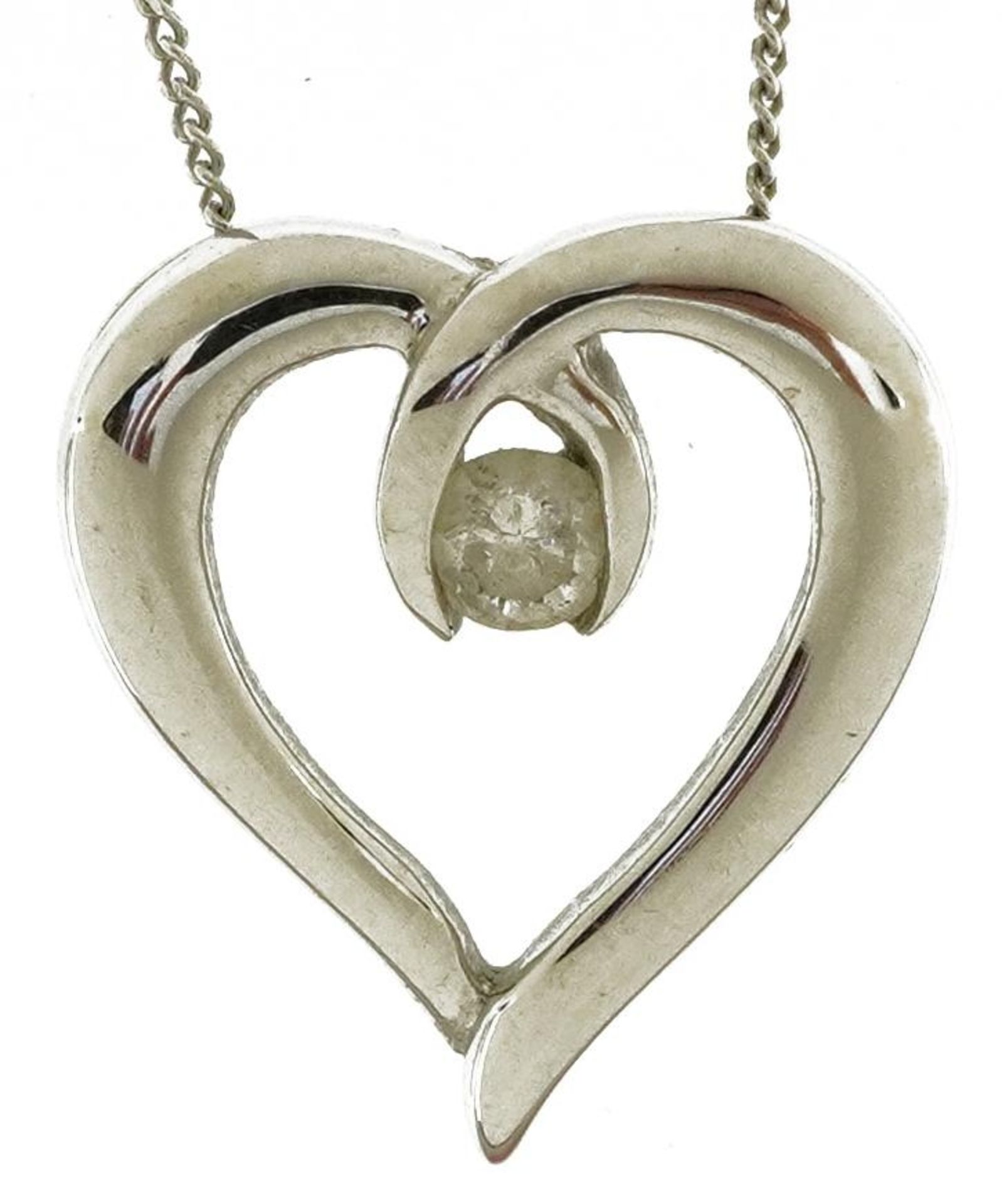 9ct white gold love heart pendant set with a diamond on 9ct white gold curb link necklace, the