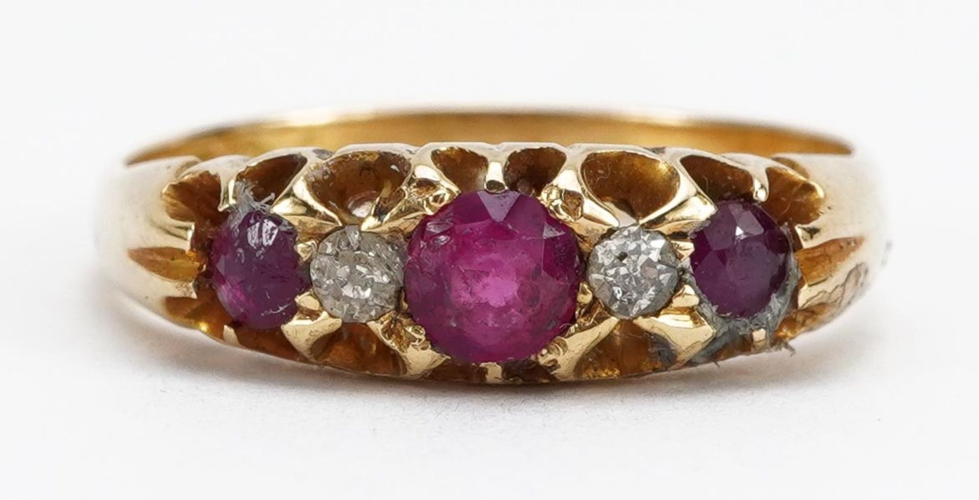 18ct gold ruby and diamond five stone ring, the largest ruby approximately 3.7mm in diameter,