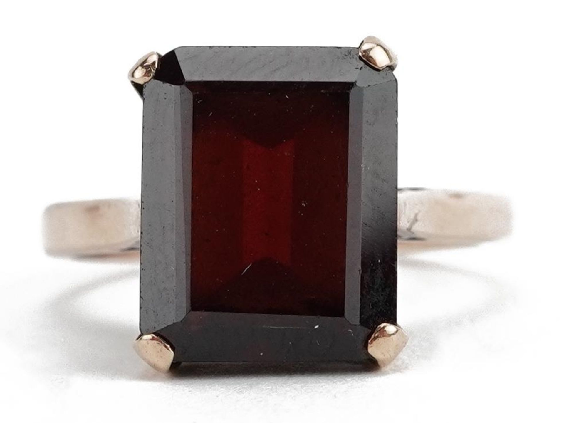 Unmarked gold red stone solitaire ring, tests as 9ct gold, the red stone approximately 11.0mm x 9.