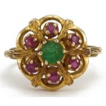 9ct gold emerald and ruby flower head ring, the emerald approximately 4.9mm in diameter, size O, 4.