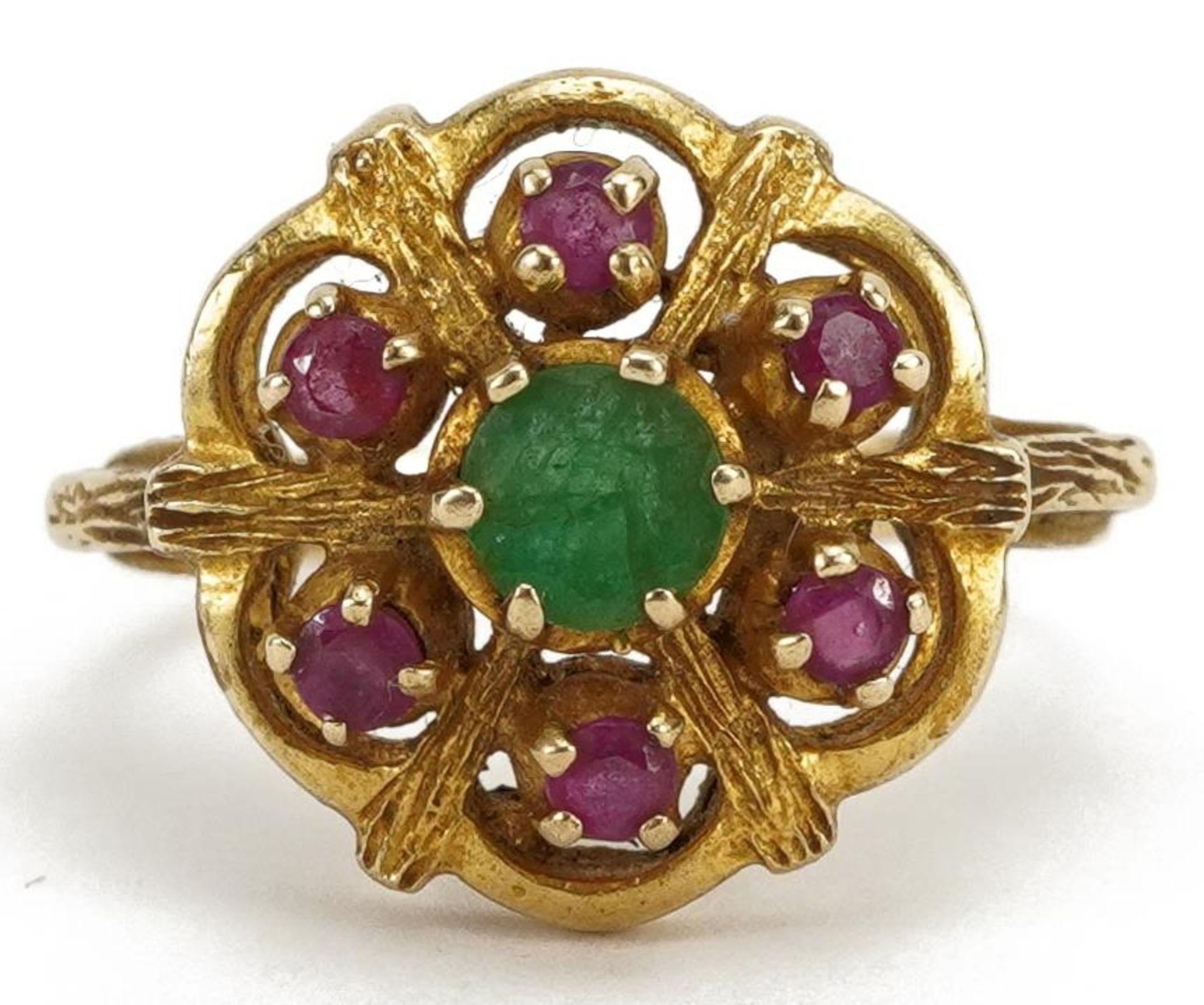 9ct gold emerald and ruby flower head ring, the emerald approximately 4.9mm in diameter, size O, 4.