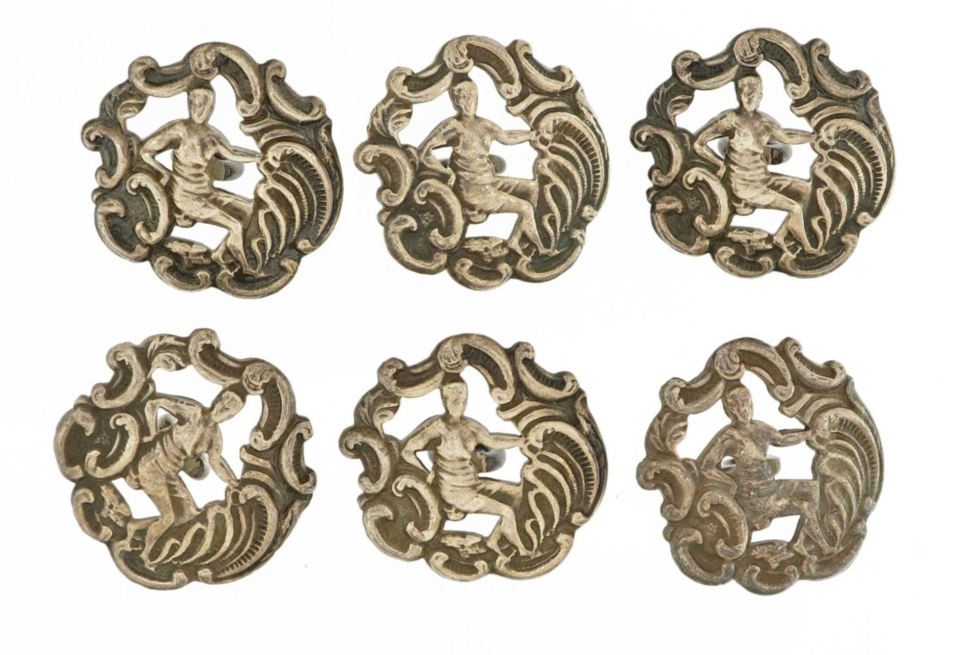 Set of six Edwardian silver buttons embossed with figures, Birmingham 1902, each 2.0cm in