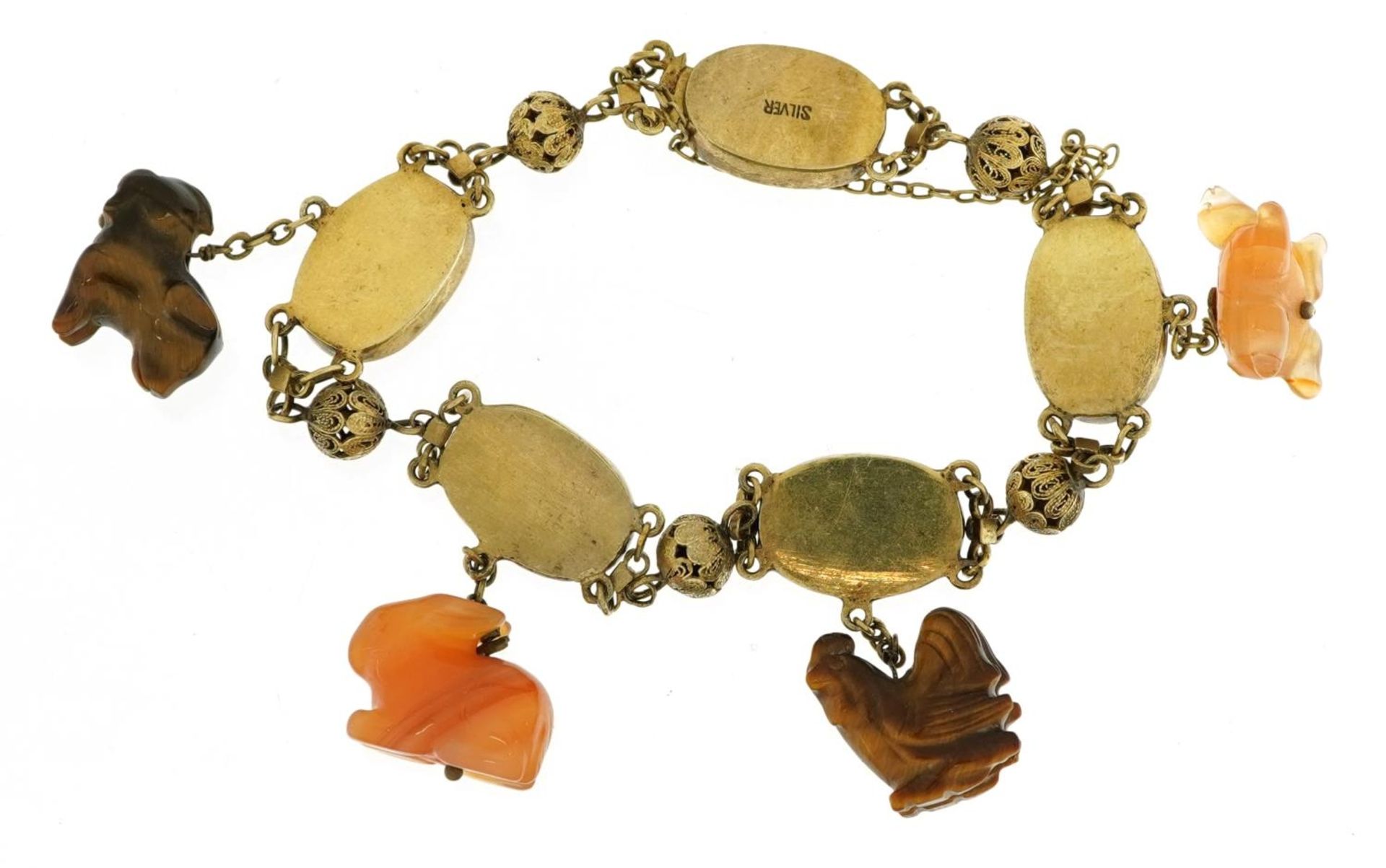 Chinese silver gilt and enamel bracelet with four carved tiger's eye and agate animal charms, 28. - Image 2 of 3